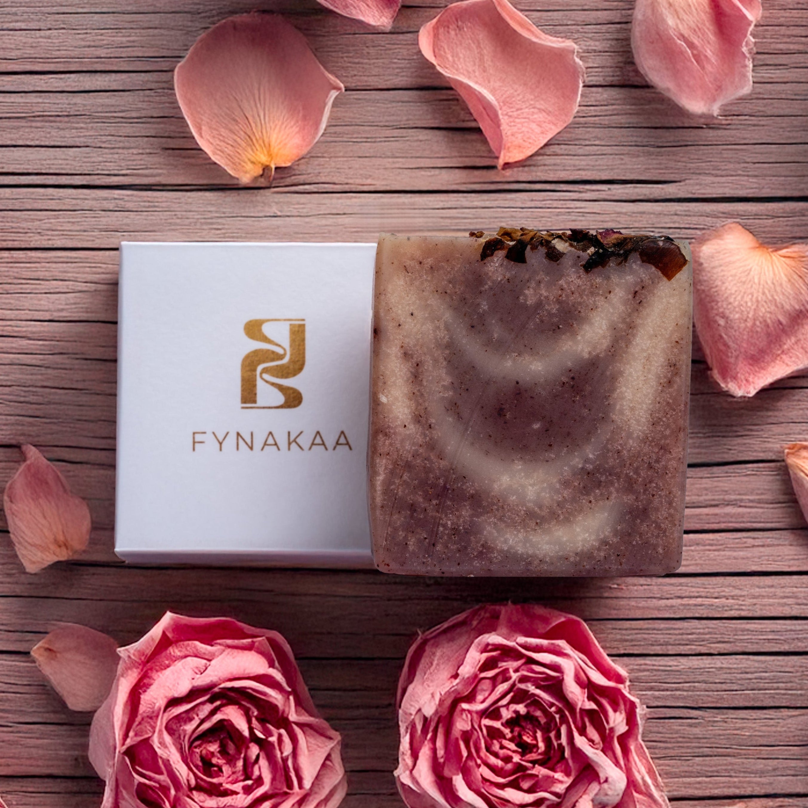 Fynakaa soap bar with pink roses and petals on a wooden surface