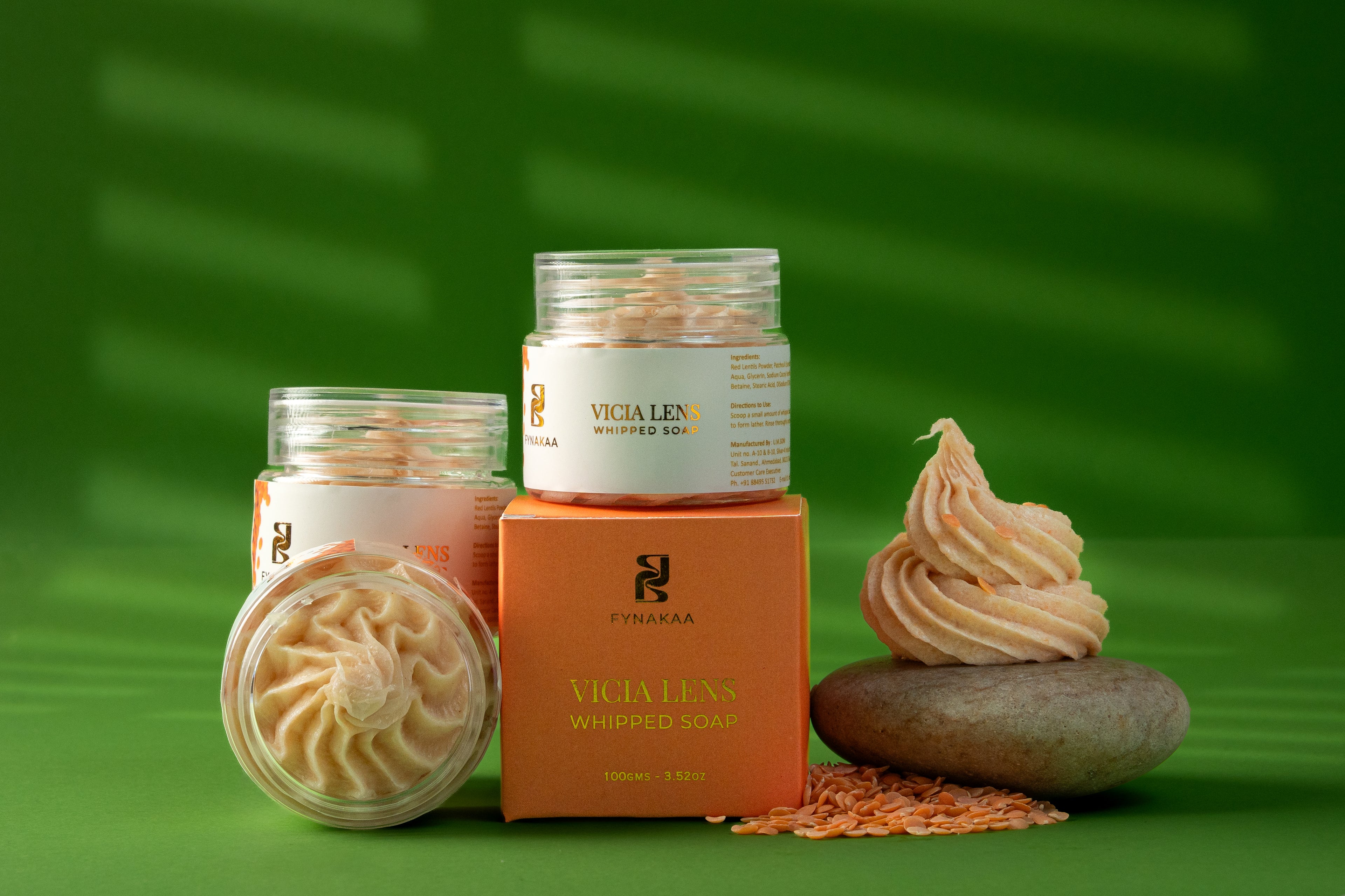 Vicia Lens whipped soap and cream with a green background